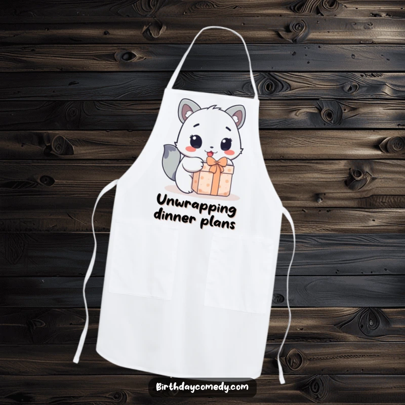 Funny apron showing a cute animal character's wide, excited eyes as it enthusiastically opens a gift.