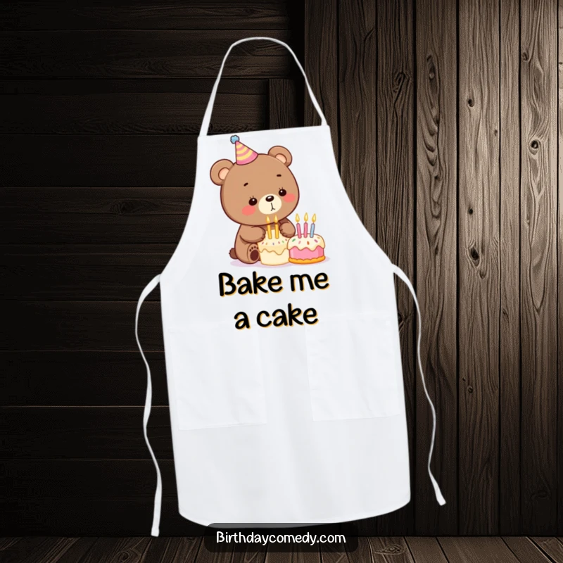 Funny birthday apron depicting a playful bear in a party hat blowing out candles on a small cake, ready for kitchen fun.