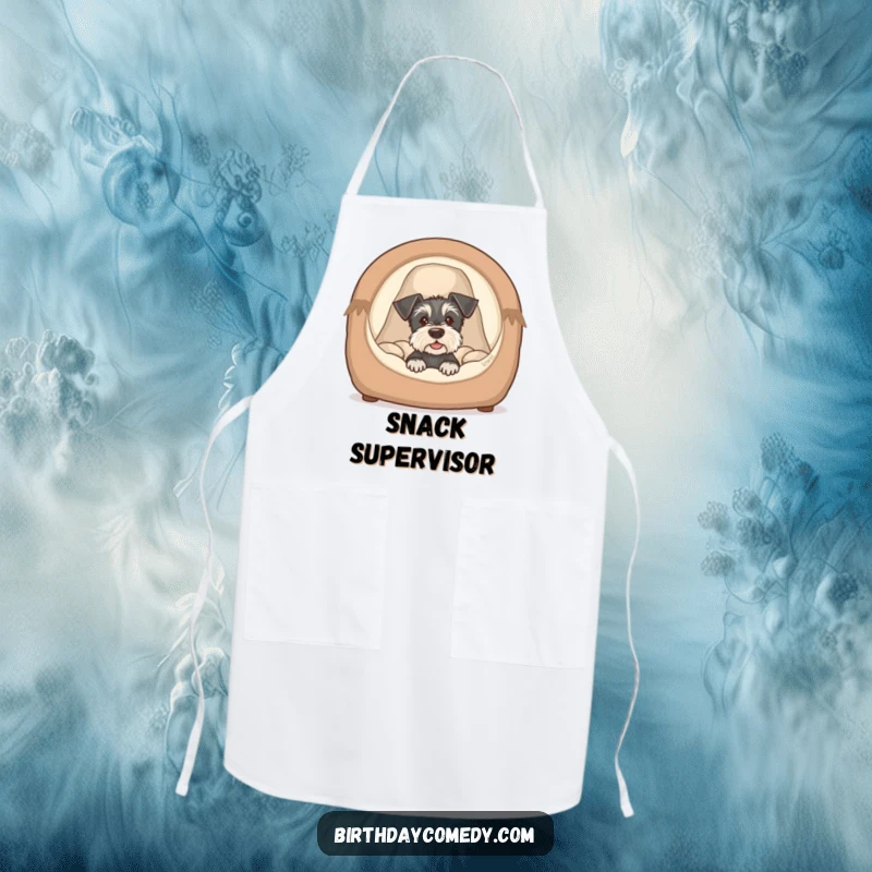 Funny schnauzer puppy apron featuring a cute dog peeking from a cozy bed, a humorous and practical kitchen accessory.