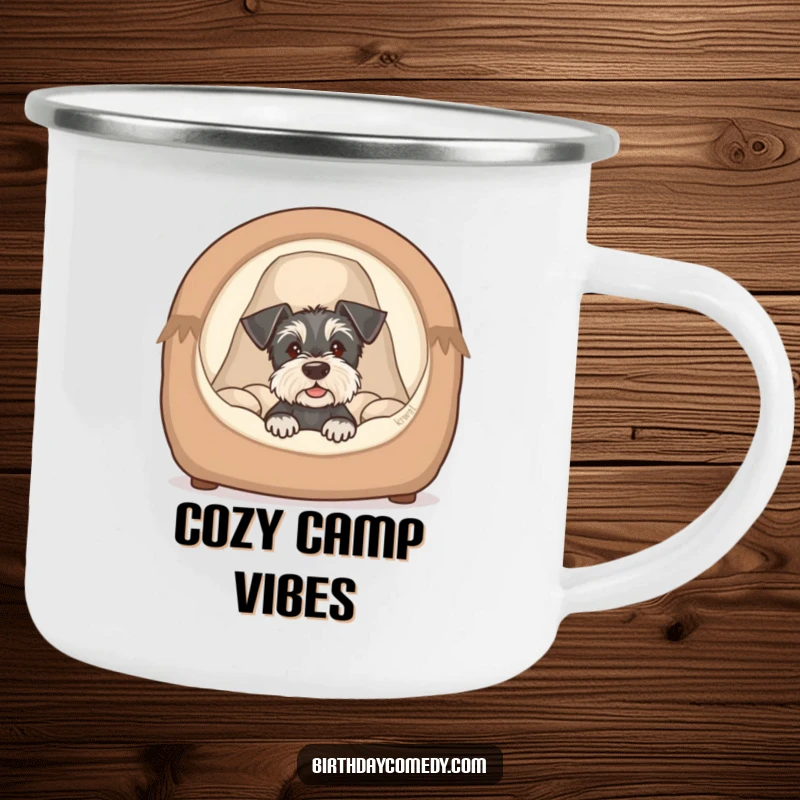Funny schnauzer puppy camping mug showing a cute dog peeking from a cozy bed, perfect for outdoor fun.