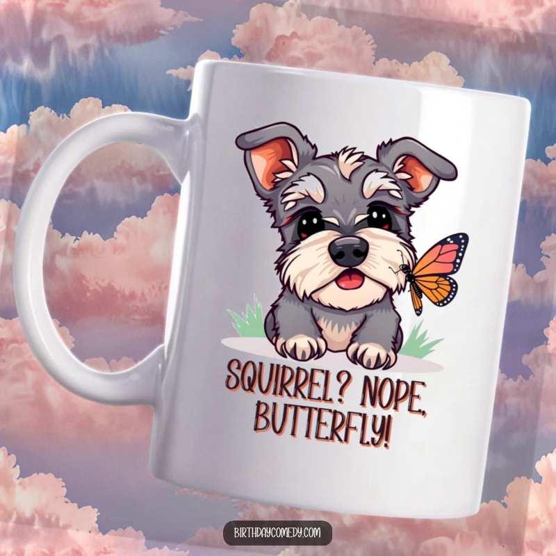Funny schnauzer mug showing a dog with head tilted, ears perked, intently watching a butterfly, a humorous pet scene.