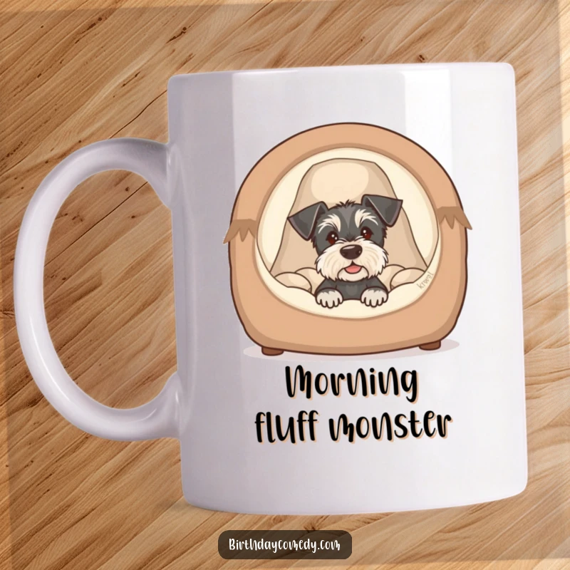 Funny schnauzer puppy mug showing a cute dog peeking from a cozy bed, exuding innocence and playful humor.