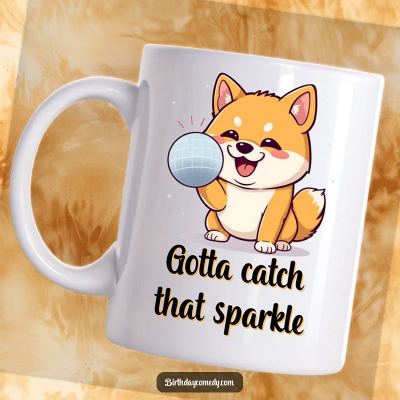 Funny Shiba Inu mug featuring a happy Shiba Inu grinning while batting at a sparkling disco ball, capturing pure joy.