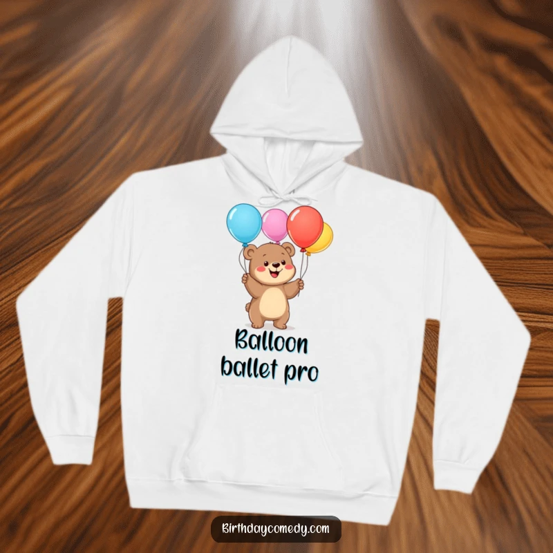 Funny bear cub hoodie, a happy cub juggling colorful balloons, perfect for cozying up with a dose of humor and warmth.