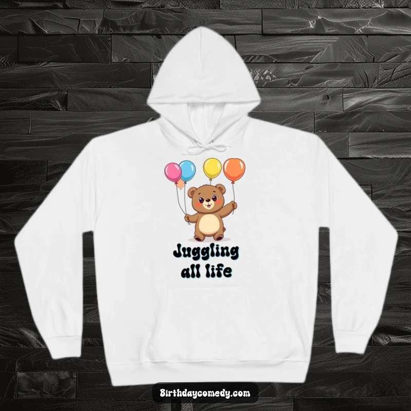 Funny bear hoodie, a cheerful, big-eyed character in the act of juggling vibrant, colorful balloons.