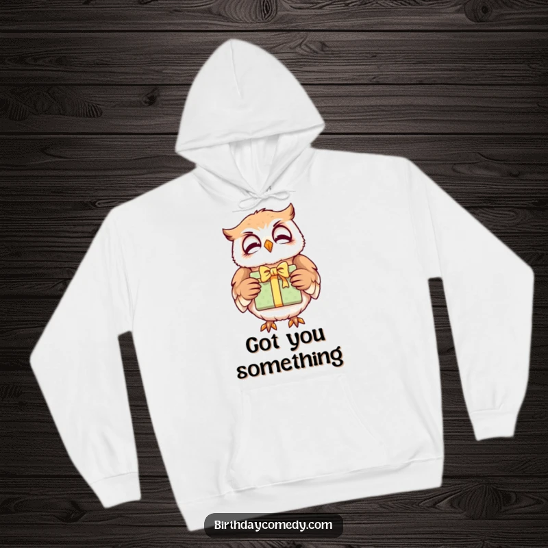 Funny owl hoodie, a giggling character holding a brightly wrapped gift, offering warm, comforting wisdom.