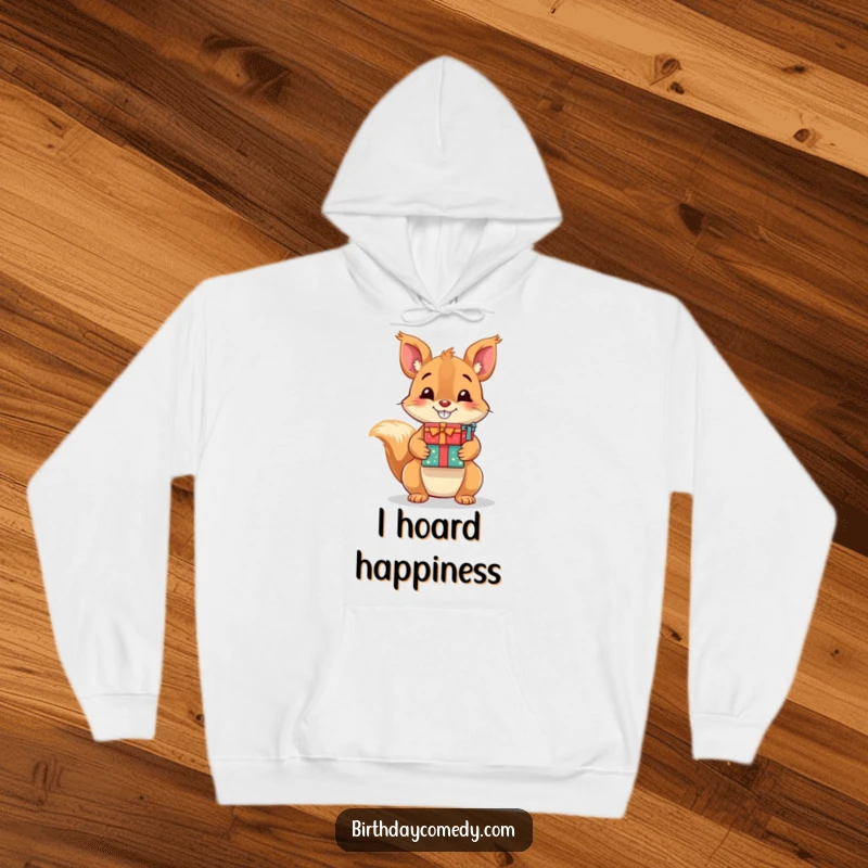 Funny hoodie showcasing a joyful squirrel with a big grin holding a stack of presents, perfect for cozy, humorous wear.