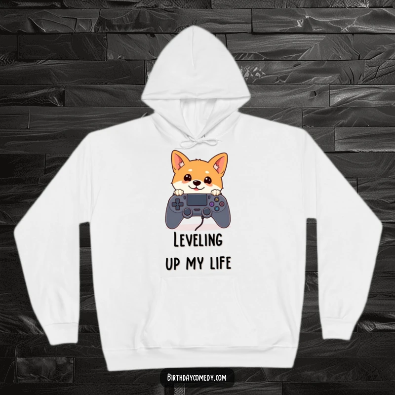 Funny Shiba Inu hoodie with a curious Shiba Inu peeking from behind an oversized game controller, perfect for cozy gaming.