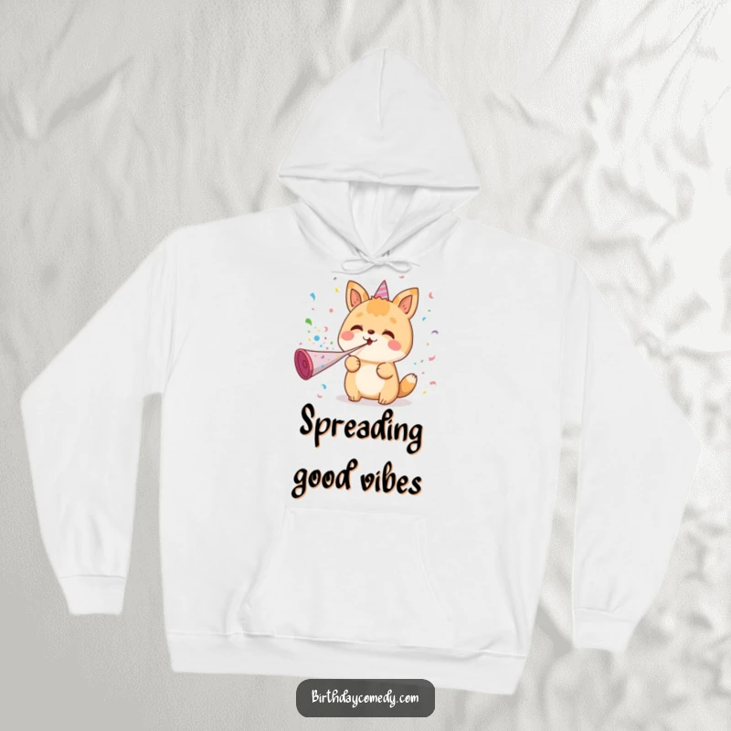 Funny hoodie with a kawaii animal character joyfully blowing confetti from a party horn, radiating fun and celebration, perfect for parties.