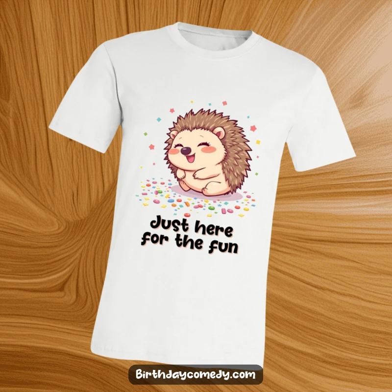 Funny hedgehog t-shirt featuring a giggling hedgehog rolling across a floor covered in colorful confetti, radiating happiness.