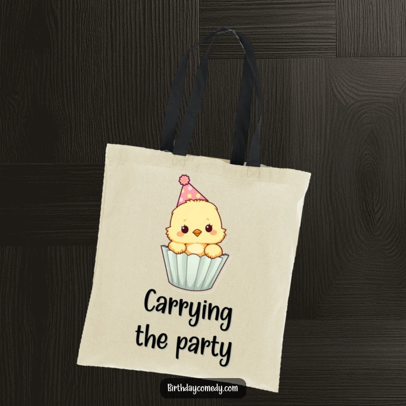 Funny fluffy chick wearing a party hat peeks out of a cupcake wrapper, a practical tote for carrying items.