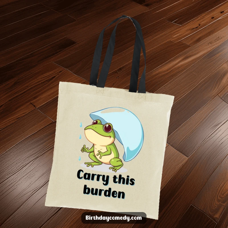 Funny frog tote bag featuring a determined frog comically pushing a giant raindrop uphill, an inspirational and humorous accessory.