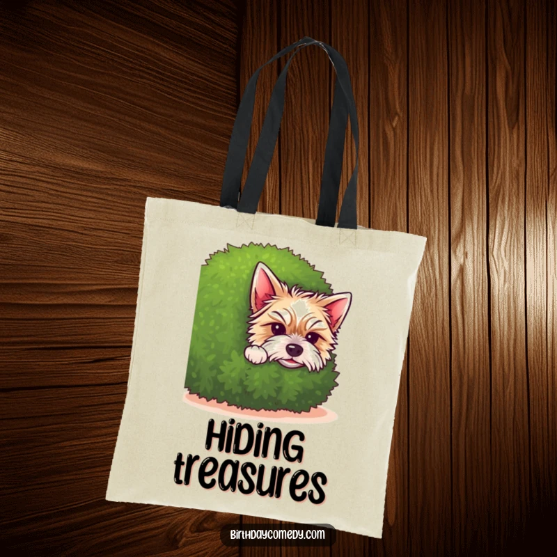 Funny terrier tote bag featuring a cute terrier puppy peeking from behind a bushy green shrub, radiating undeniable charm.